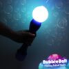 An individual raises a luminous bubble toy, the Flashing Bubble Wand Ball, casting a radiant glow in the environment.